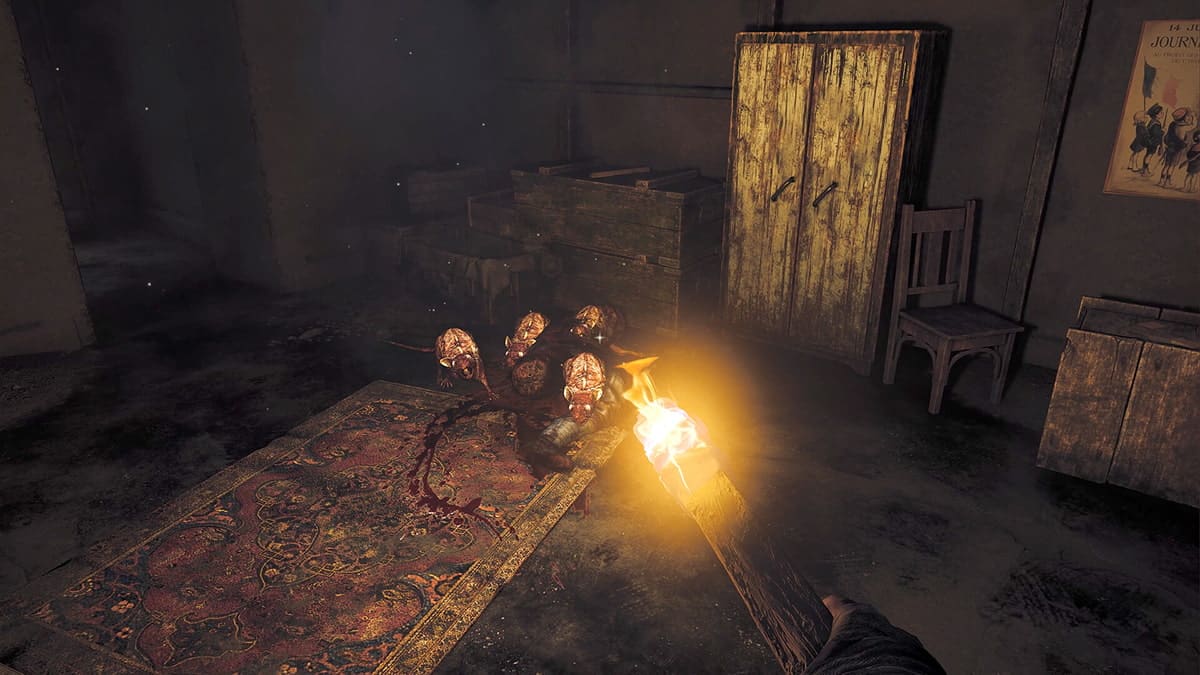 Player driving away aggressive rats with a torch in Amnesia: The Bunker