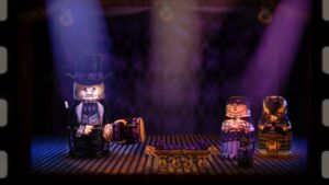 A magician matryoshka doll performs on stage under spotlights with other nesting dolls in Stacking.